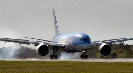 Photo of T.U.I airplane on the runway
